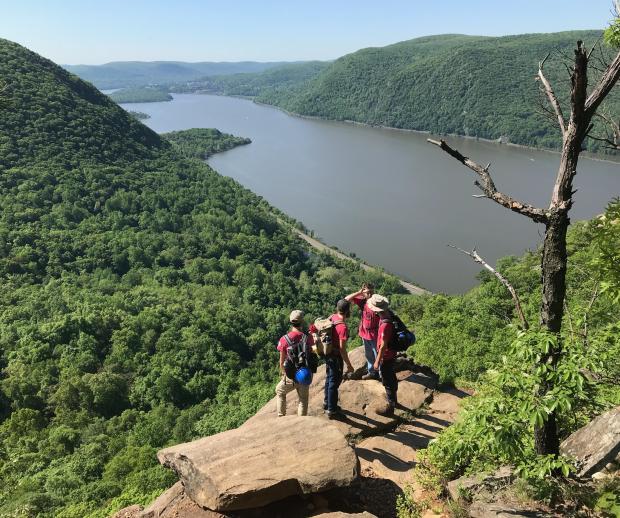 The Trail Conference's Taconic Crew Looks Out Over the Hudson River from Breakneck Ridge. Photo Credit: Erik Mickelson.